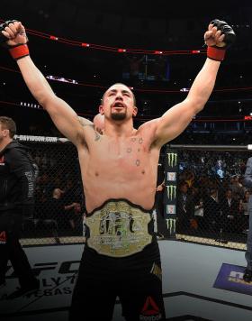 Robert Whittaker of New Zealand celebrates after defeating Yoel Romero of Cuba by split decision in their middleweight fight during the UFC 225 event at the United Center on June 9, 2018 in Chicago, Illinois. (Photo by Josh Hedges/Zuffa LLC)