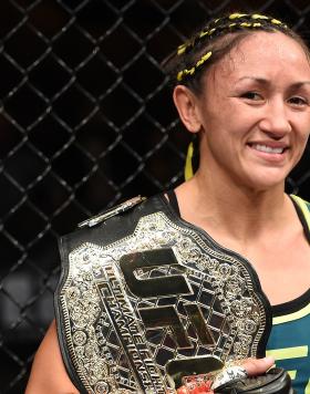 Carla Esparza celebrates her submission victory over Rose Namajunas in the third round and becomes the first UFC women's srawwieght champion during The Ultimate Fighter Finale event inside the Pearl concert theater at the Palms Casino Resort on December 12, 2014 in Las Vegas, Nevada. (Photo by Jeff Bottari/Zuffa LLC)