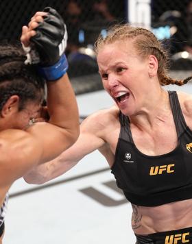 Valentina Shevchenko of Kyrgyzstan punches Taila Santos of Brazil in the UFC flyweight championship fight during the UFC 275 event at Singapore Indoor Stadium on June 12, 2022 in Singapore. (Photo by Jeff Bottari/Zuffa LLC)