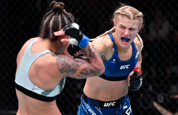 Manon Fiorot of France punches Mayra Bueno Silva of Brazil in a flyweight fight during the UFC Fight Night event at UFC APEX on October 16, 2021 in Las Vegas, Nevada. (Photo by Chris Unger/Zuffa LLC)