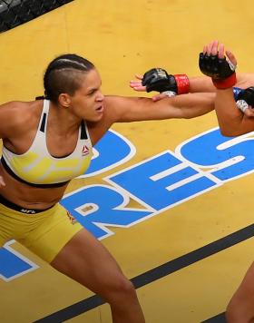 Amanda Nunes punches Miesha Tate during the UFC 200 event on July 9, 2016 at T-Mobile Arena in Las Vegas, Nevada. (Photo by Ed Mulholland/Zuffa LLC)