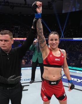 Raquel Pennington gets her hand raised after defeating Apsen Ladd at UFC 273