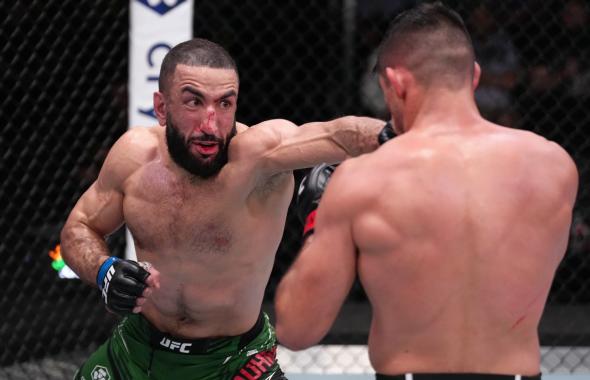 Belal Muhammad punches Vicente Luque of Brazil in a welterweight fight during the UFC Fight Night event at UFC APEX on April 16, 2022 in Las Vegas, Nevada. (Photo by Jeff Bottari/Zuffa LLC)