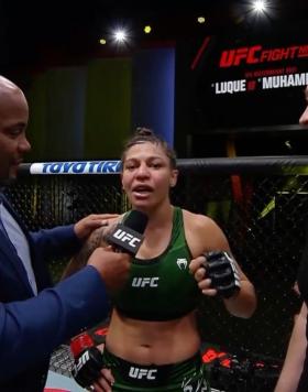 Mayra Bueno Silva talks with Daniel Cormier after winning at UFC Fight Night: Luque vs Muhammad 2