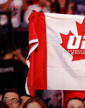 A fan holds up a canadian flag with a UFC logo on it during the fight between Alessio Sakara and Patrick Cote during UFC 154 on November 17, 2012 at the Bell Centre in Montreal, Canada. (Photo by Josh Hedges/Zuffa LLCGetty Images)