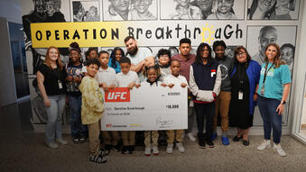 UFC athletes Julian Marquez and Jonathan Martinez spend time with middle school students as part of Operation Breakthrough in Kansas City, MO.