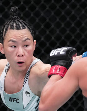 Yan Xiaonan of China punches Mackenzie Dern in a strawweight fight during the UFC Fight Night event at UFC APEX on October 01, 2022 in Las Vegas, Nevada. (Photo by Jeff Bottari/Zuffa LLC)