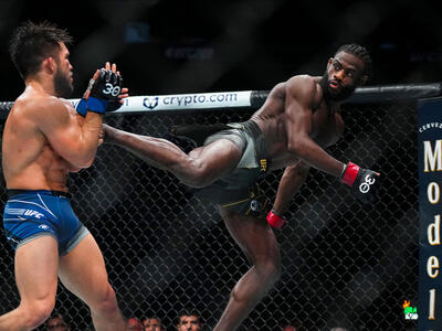 Aljamain Sterling kicks Henry Cejudo in the UFC bantamweight championship fight during the UFC 288 event at Prudential Center on May 06, 2023 in Newark, New Jersey. (Photo by Cooper Neill/Zuffa LLC