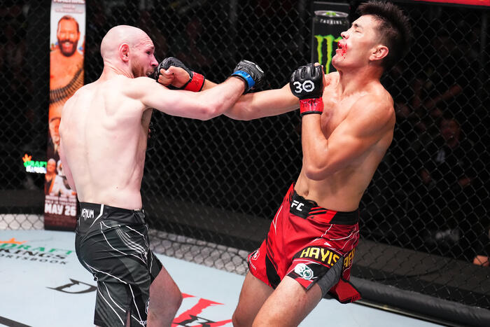 Viacheslav Borshchev of Russia punches Maheshate of China in a lightweight fight during the UFC Fight Night event at UFC APEX on May 20, 2023 in Las Vegas, Nevada. (Photo by Chris Unger/Zuffa LLC)