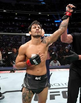 Alexandre Pantoja of Brazil reacts after defeating Alex Perez in a flyweight fight during the UFC 277 event