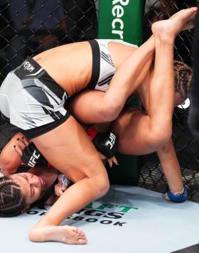 Mayra Bueno Silva works for an arm bar submission against Stephanie Egger in a bantamweight fight during the UFC Fight Night: Santos vs Hill