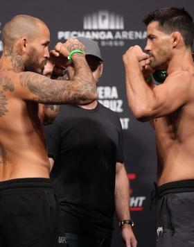  Opponents Marlon Vera of Ecuador and Dominick Cruz face off during the UFC Fight Night ceremonial weigh-in at Pechanga Arena