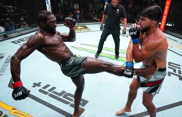 Jared Cannonier kicks Kelvin Gastelum in a middleweight fight during the UFC Fight Night event at UFC APEX