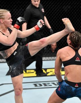 Valentina Shevchenko of Kyrgyzstan knocks out Jessica Eye in their women's flyweight championship bout during the UFC 238 event at the United Center