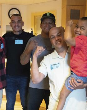 UFC athletes Gilbert Burns, Renato Moicano, and Billy Quarantillo visit the Orlando Children's Hospital on December 1st. (Zuffa LLC)
