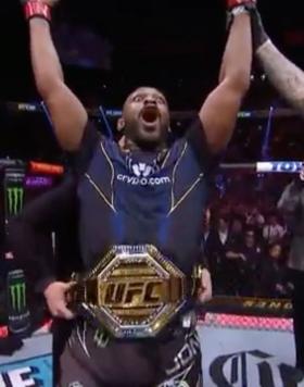 Jon Jones Celebrates winning the UFC heavyweight championship