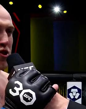 Heavyweight Serghei Spivac talks with Michael Bisping after his win over Derrick Lewis