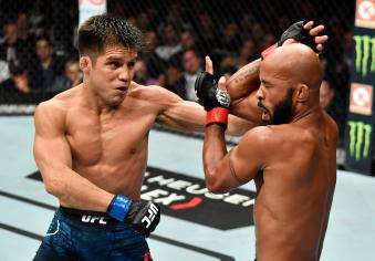 LOS ANGELES, CA - AUGUST 04: (L-R) Henry Cejudo punches Demetrious Johnson in their UFC flyweight championship fight during the UFC 227 event inside Staples Center on August 4, 2018 in Los Angeles, California. (Photo by Jeff Bottari/Zuffa LLC/Zuffa LLC via Getty Images)