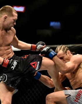 Petr Yan of Russia knees Urijah Faber in their bantamweight bout during the UFC 245 event at T-Mobile Arena on December 14, 2019 in Las Vegas, Nevada. (Photo by Chris Unger/Zuffa LLC)