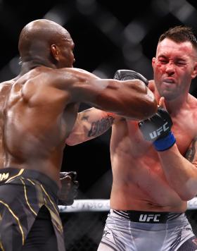 Colby Covington punches Kamaru Usman in their welterweight title bout during the UFC 268 event at Madison Square Garden on November 06, 2021 in New York City. (Photo by Mike Stobe/Getty Images)