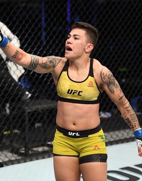  Jessica Andrade of Brazil celebrates her TKO victory over Katlyn Chookagian in their women's flyweight bout during the UFC Fight Night event inside Flash Forum on UFC Fight Island on October 18, 2020 in Abu Dhabi, United Arab Emirates. (Photo by Josh Hedges/Zuffa LLC via Getty Images)