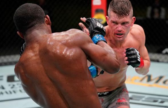 Stephen Thompson punches Geoff Neal in a welterweight fight during the UFC Fight Night event at UFC APEX on December 19, 2020 in Las Vegas, Nevada. (Photo by Cooper Neill/Zuffa LLC)