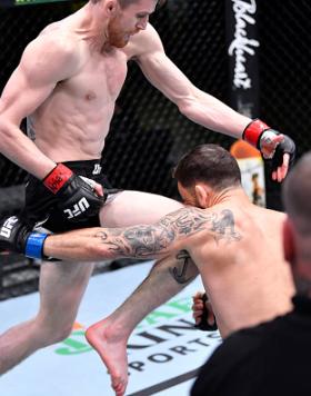 Cory Sandhagen lands a flying knee to knock out Frankie Edgar in their bantamweight fight during the UFC Fight Night event at UFC APEX on February 06, 2021 in Las Vegas, Nevada. (Photo by Chris Unger/Zuffa LLC)