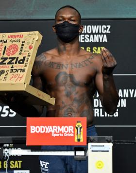 Israel Adesanya of Nigeria poses on the scale during the UFC 259 weigh-in at UFC APEX on March 05, 2021 in Las Vegas, Nevada. (Photo by Jeff Bottari/Zuffa LLC)