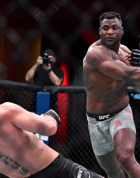 Francis Ngannou of Cameroon drops Stipe Miocic in their UFC heavyweight championship fight during the UFC 260 event at UFC APEX (Zuffa/GettyImages)