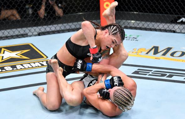Tracy Cortez punches Justine Kish in a flyweight fight during the UFC Fight Night event at UFC APEX on April 17, 2021 in Las Vegas, Nevada. (Photo by Chris Unger/Zuffa LLC)