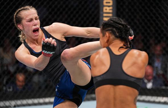 Katlyn Chookagian kicks Viviane Araujo of Brazil in their women's flyweight bout during the UFC 262 event at Toyota Center on May 15, 2021 in Houston, Texas. (Photo by Josh Hedges/Zuffa LLC)