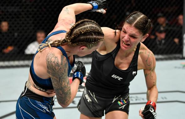 Lauren Murphy punches Joanne Calderwood of Scotland in their flyweight fight during the UFC 263 event at Gila River Arena on June 12, 2021 in Glendale, Arizona. (Photo by Jeff Bottari/Zuffa LLC)