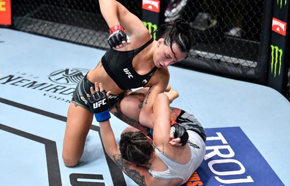 Casey O'Neill of Scotland punches Lara Procopio of Brazil in a flyweight bout during the UFC Fight Night event at UFC APEX on June 19, 2021 in Las Vegas, Nevada. (Photo by Chris Unger/Zuffa LLC)