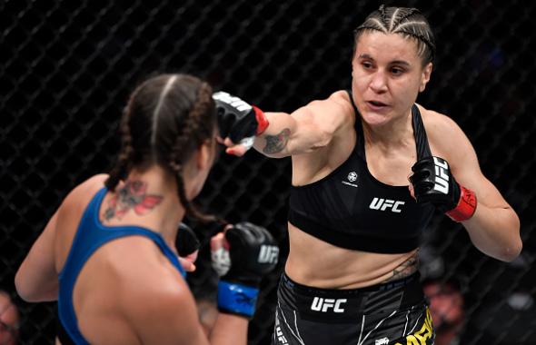 Jennifer Maia of Brazil punches Jessica Eye in their flyweight fight during the UFC 264 event at T-Mobile Arena on July 10, 2021 in Las Vegas, Nevada. (Photo by Jeff Bottari/Zuffa LLC)
