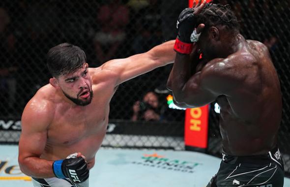 Kelvin Gastelum punches Jared Cannonier in a middleweight fight during the UFC Fight Night event at UFC APEX on August 21, 2021 in Las Vegas, Nevada. (Photo by Chris Unger/Zuffa LLC)