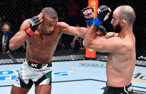 Edson Barboza of Brazil punches Giga Chikadze of Georgia in a featherweight fight during the UFC Fight Night event at UFC APEX on August 28, 2021 in Las Vegas, Nevada. (Photo by Chris Unger/Zuffa LLC)