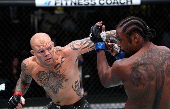 Anthony Smith punches Ryan Spann in a light heavyweight fight during the UFC Fight Night event at UFC APEX on September 18, 2021 in Las Vegas, Nevada. (Photo by Jeff Bottari/Zuffa LLC)