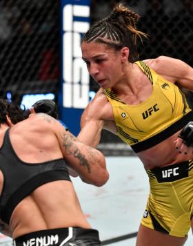 Amanda Ribas of Brazil punches Virna Jandiroba of Brazil in a strawweight fight during the UFC 267 event at Etihad Arena on October 30, 2021 in Yas Island, Abu Dhabi, United Arab Emirates. (Photo by Chris Unger/Zuffa LLC)