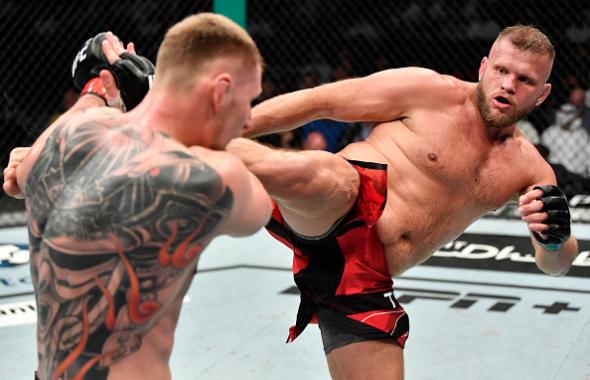 Marcin Tybura of Poland kicks Alexander Volkov of Russia in a heavyweight fight during the UFC 267 event at Etihad Arena on October 30, 2021 in Yas Island, Abu Dhabi, United Arab Emirates. (Photo by Chris Unger/Zuffa LLC)