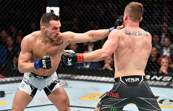 Michael Chandler punches Justin Gaethje in their lightweight fight during the UFC 268 event at Madison Square Garden on November 06, 2021 in New York City. (Photo by Jeff Bottari/Zuffa LLC)