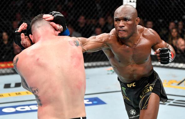 Kamaru Usman of Nigeria punches Colby Covington in their UFC welterweight championship fight during the UFC 268 event at Madison Square Garden on November 06, 2021 in New York City. (Photo by Jeff Bottari/Zuffa LLC)