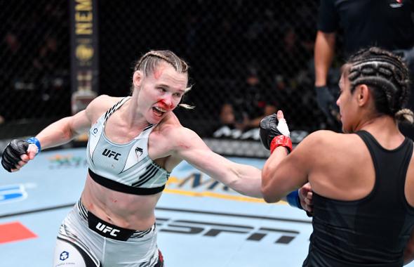 Andrea Lee punches Cynthia Calvillo in a flyweight fight during the UFC Fight Night event at UFC APEX on November 13, 2021 in Las Vegas, Nevada. (Photo by Chris Unger/Zuffa LLC)