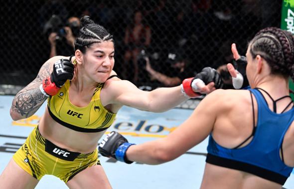 Ketlen Vieira of Brazil punches Miesha Tate in a bantamweight fight during the UFC Fight Night event at UFC APEX on November 20, 2021 in Las Vegas, Nevada. (Photo by Chris Unger/Zuffa LLC)