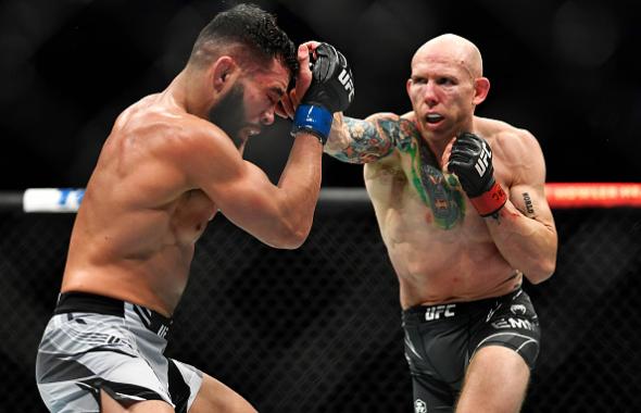 Josh Emmett punches Dan Ige in their featherweight bout during the UFC 269 on December 11, 2021 in Las Vegas, Nevada. (Photo by Chris Unger/Zuffa LLC)