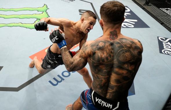 Kai Kara-France of New Zealand punches Cody Garbrandt in their flyweight bout during the UFC 269 on December 11, 2021 in Las Vegas, Nevada. (Photo by Jeff Bottari/Zuffa LLC)