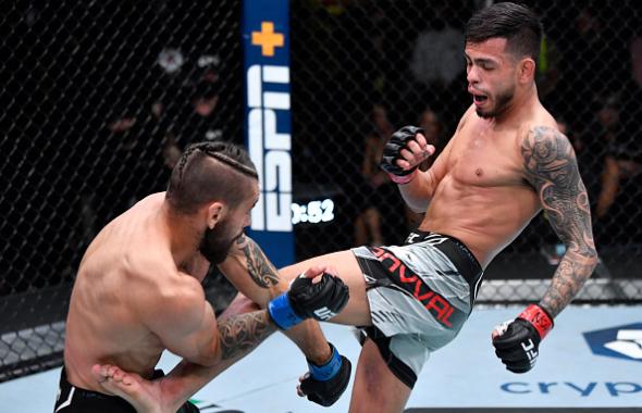 Brandon Royval kicks Rogerio Bontorin of Brazil in their flyweight fight during the UFC Fight Night event at UFC APEX on January 15, 2022 in Las Vegas, Nevada. (Photo by Jeff Bottari/Zuffa LLC via Getty Images)