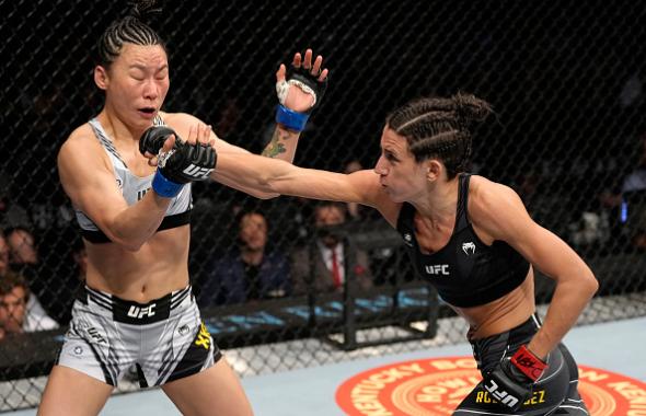 Marina Rodriguez of Brazil punches Yan Xiaonan of China in their strawweight fight during the UFC 272 event on March 05, 2022 in Las Vegas, Nevada. (Photo by Jeff Bottari/Zuffa LLC)