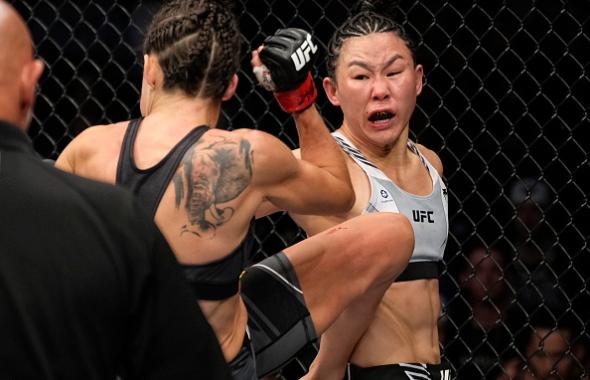 Xiaonan Yan of China lands a spinning back fist against Marina Rodriguez of Brazil in their strawweight fight during the UFC 272 event on March 05, 2022 in Las Vegas, Nevada. (Photo by Jeff Bottari/Zuffa LLC)
