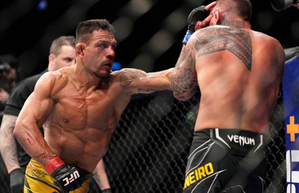 Rafael Dos Anjos of Brazil punches Renato Moicano of Brazil in their 160-pound catchweight fight during the UFC 272 event on March 05, 2022 in Las Vegas, Nevada. (Photo by Chris Unger/Zuffa LLC)