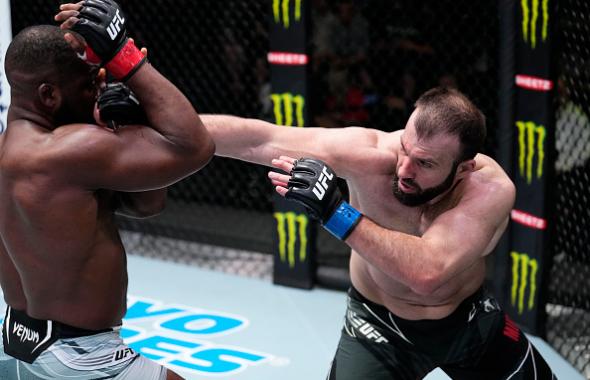 Azamat Murzakanov of Russia punches Tafon Nchukwi of Cameroon in their light heavyweight fight during the UFC Fight Night event at UFC APEX on March 12, 2022 in Las Vegas, Nevada. (Photo by Chris Unger/Zuffa LLC)
